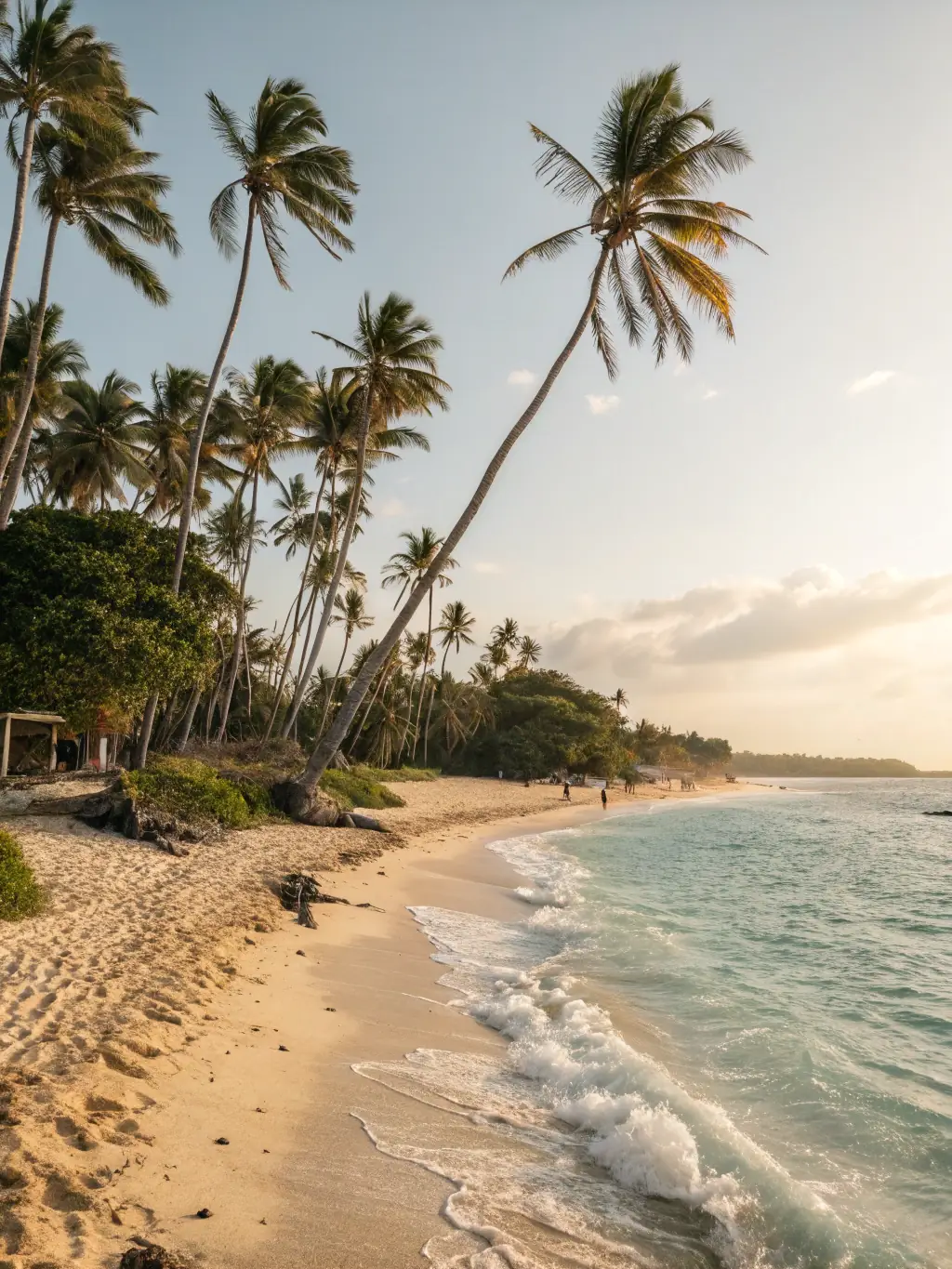 An aerial shot of a pristine beach with golden sands and turquoise waters, highlighting the relaxation and beauty of a beach escape.
